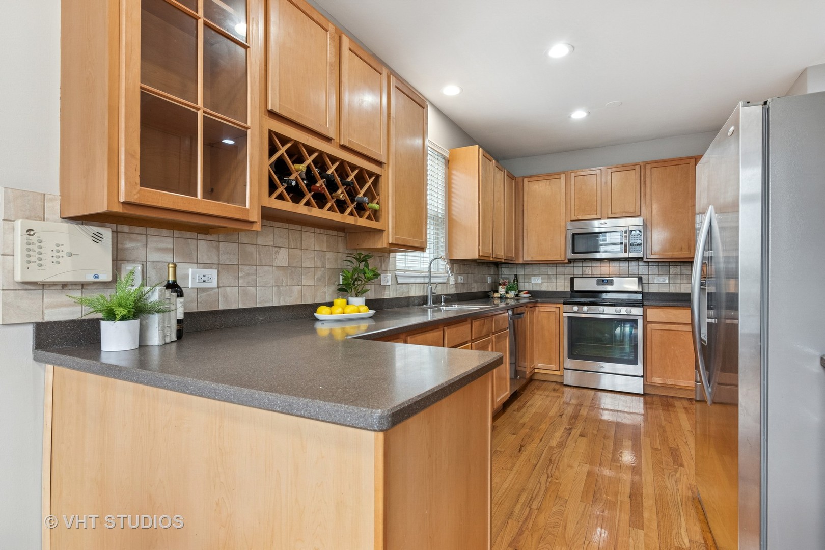 5178 Scott Circle Lisle, IL 60532 - Photo 15 of 45 a kitchen with stainless steel appliances granite countertop a sink a stove and a refrigerator
