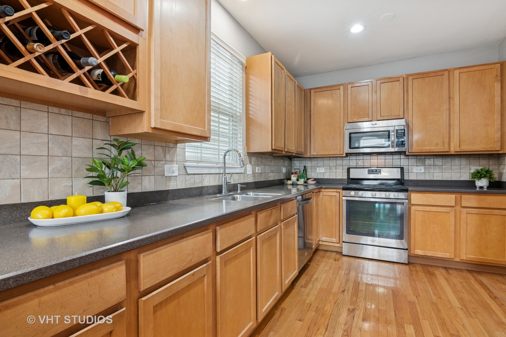 5178 Scott Circle Lisle, IL 60532 - Photo 16 of 45 a kitchen with stainless steel appliances granite countertop a sink a stove and cabinets