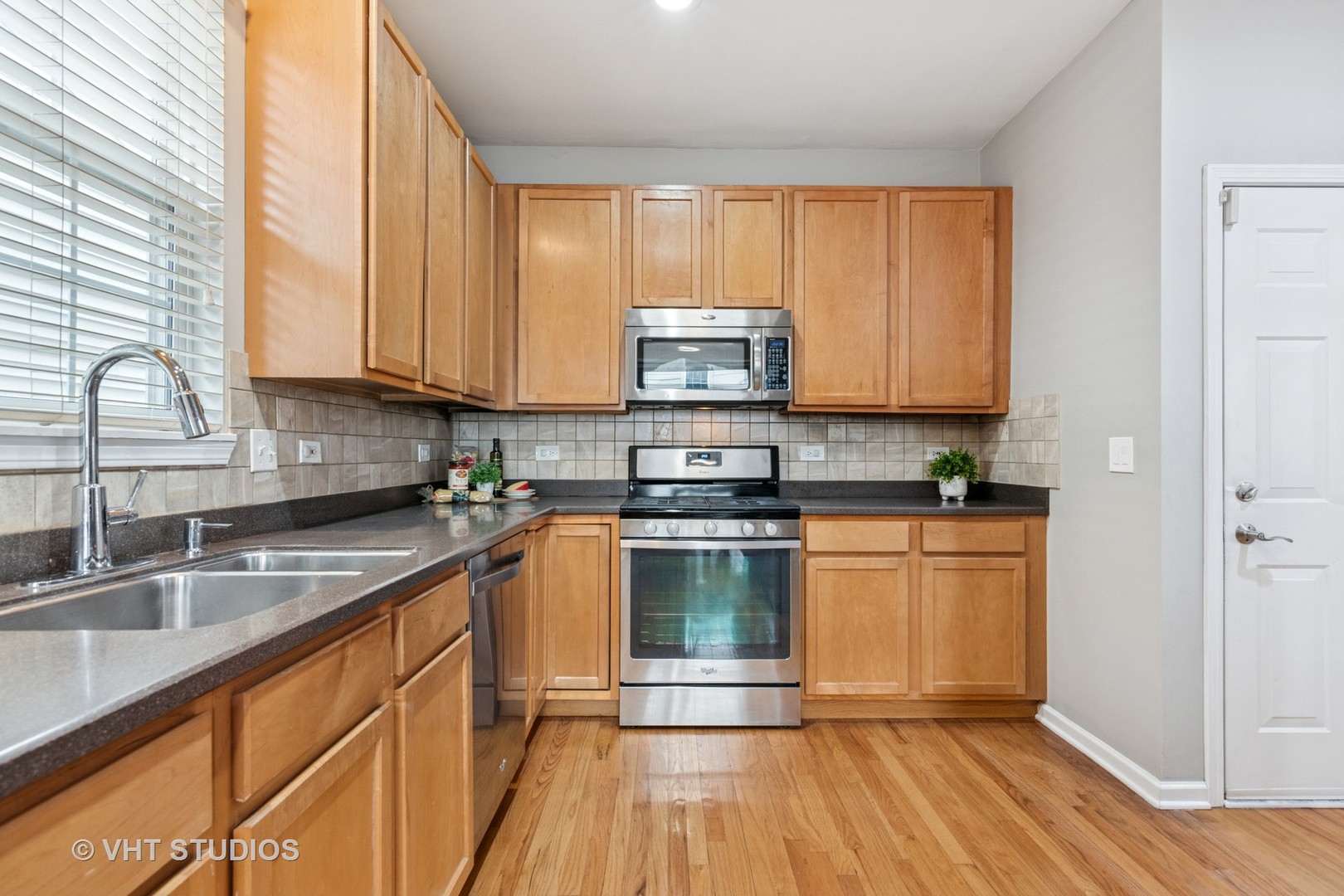 5178 Scott Circle Lisle, IL 60532 - Photo 17 of 45 a kitchen with stainless steel appliances granite countertop a sink a stove and cabinets