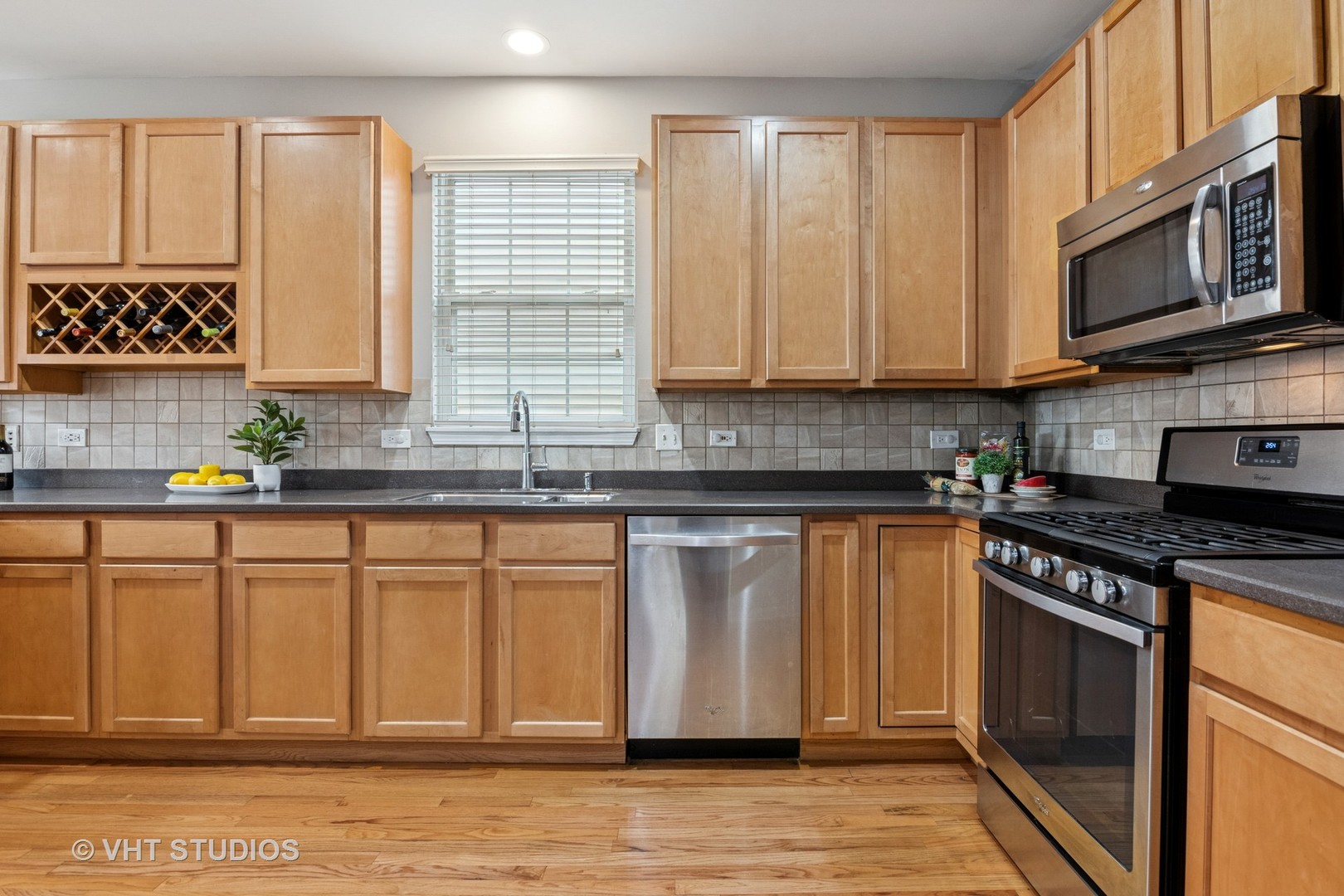 5178 Scott Circle Lisle, IL 60532 - Photo 18 of 45 a kitchen with stainless steel appliances granite countertop a stove a sink and a microwave