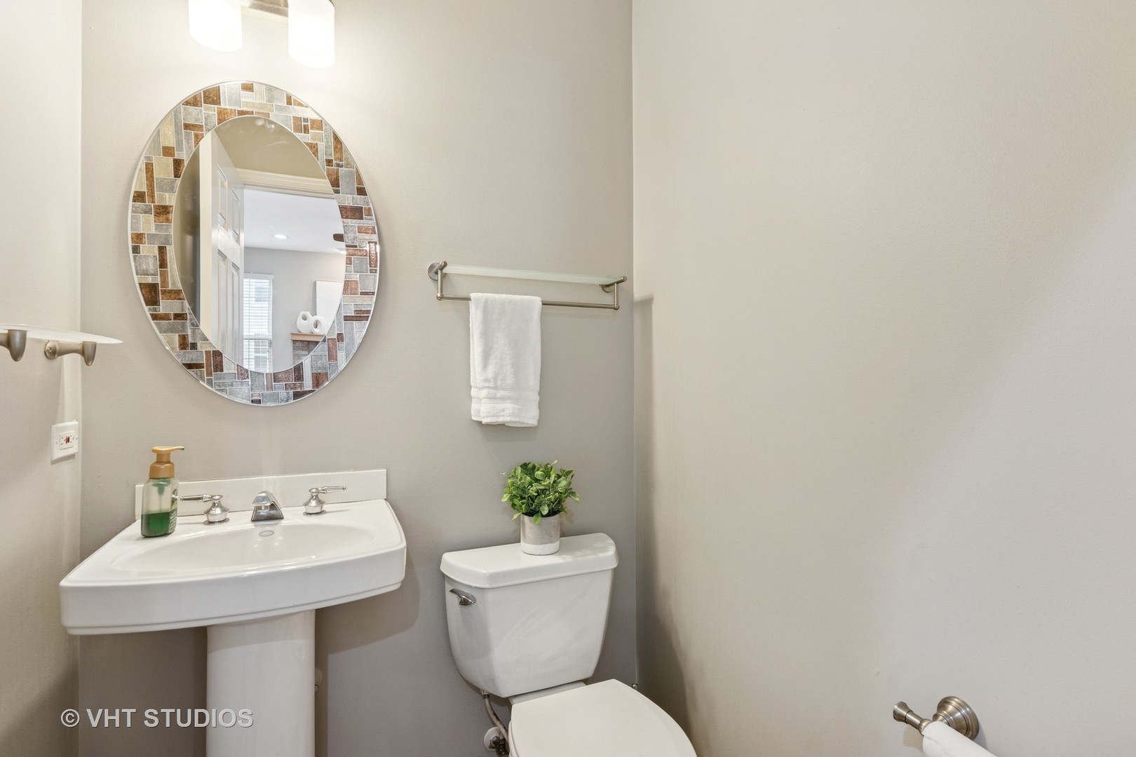 5178 Scott Circle Lisle, IL 60532 - Photo 21 of 45 a bathroom with a toilet a sink and a mirror