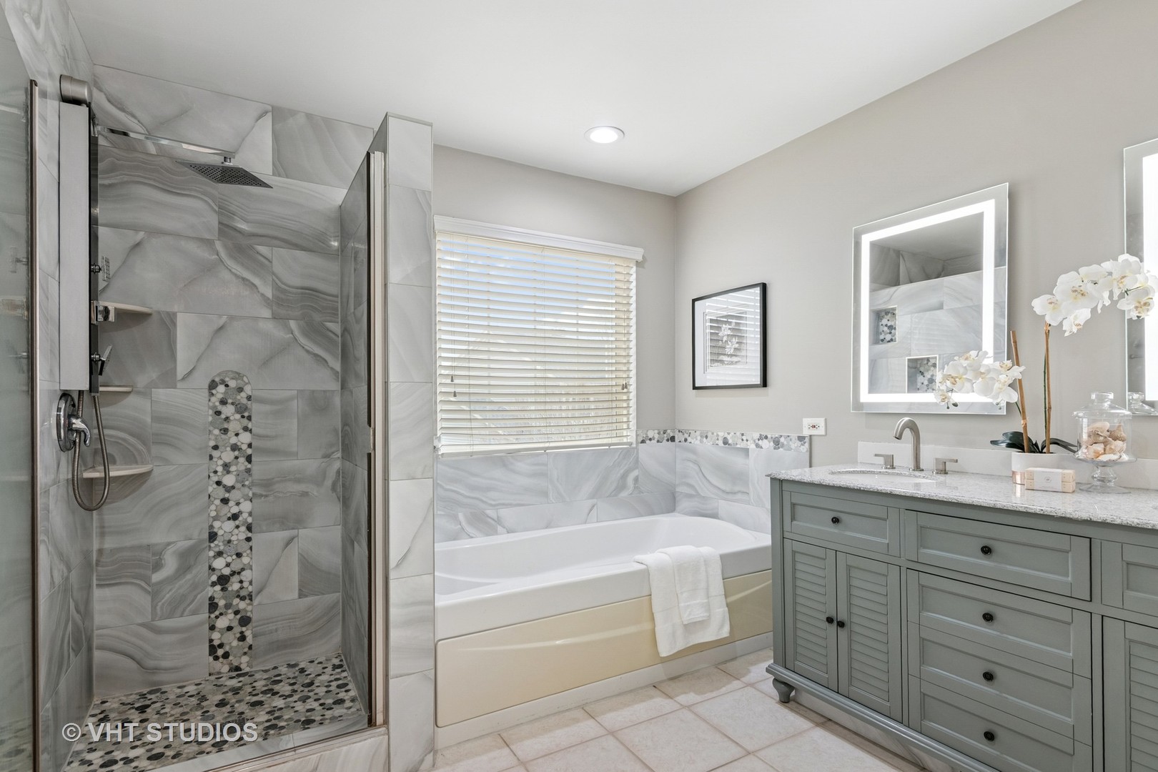 5178 Scott Circle Lisle, IL 60532 - Photo 38 of 45 a bathroom with a tub sink and mirror