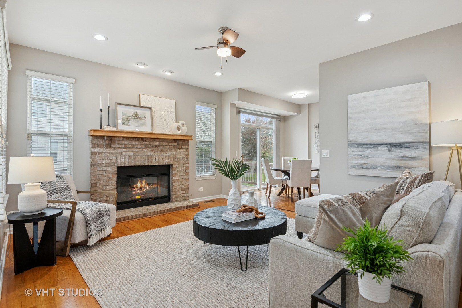 5178 Scott Circle Lisle, IL 60532 - Photo 9 of 45 a living room with furniture potted plant and a fireplace