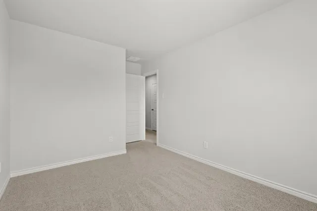 a bathroom with a granite countertop sink a toilet and bathtub