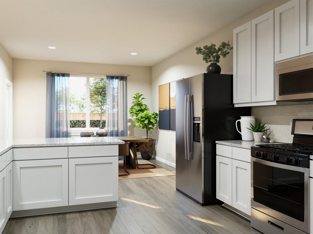 1500 Romans Road Ennis, TX 75119 - Photo 28 of 38 a kitchen with a refrigerator and a sink