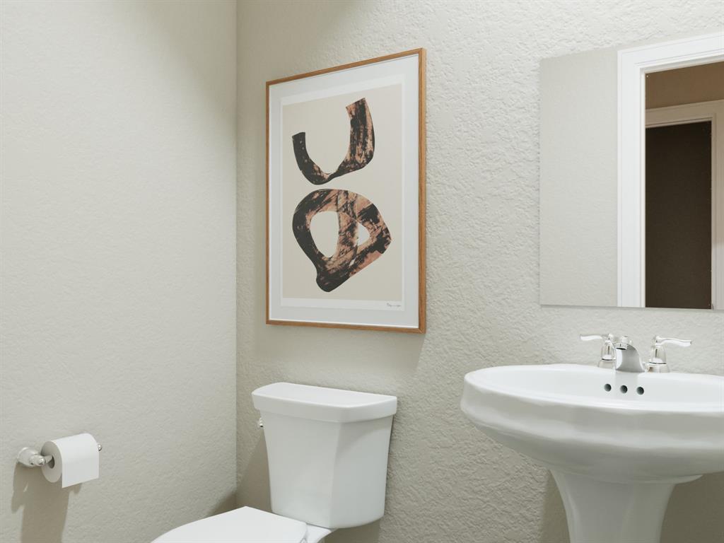 1500 Romans Road Ennis, TX 75119 - Photo 29 of 38 a bathroom with a toilet and a sink