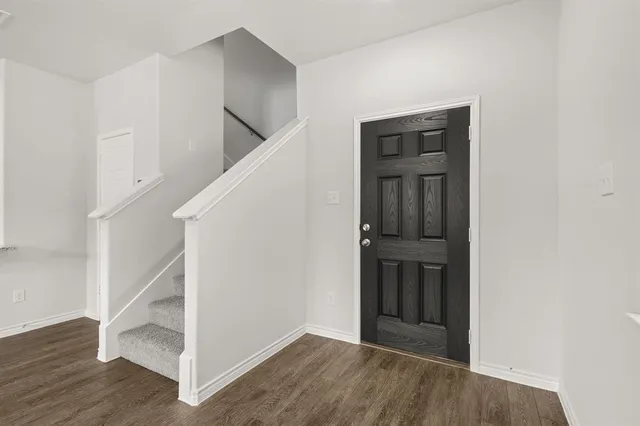 a view of an entryway with hallway