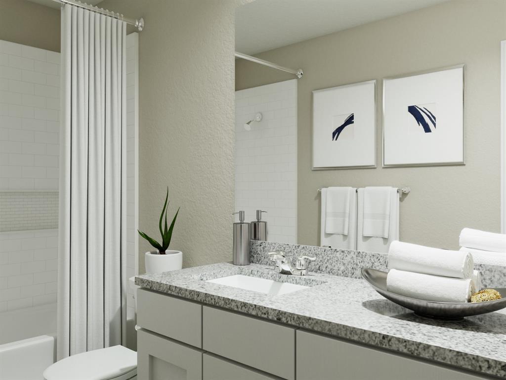 1500 Romans Road Ennis, TX 75119 - Photo 37 of 38 a bathroom with a granite countertop sink and a mirror