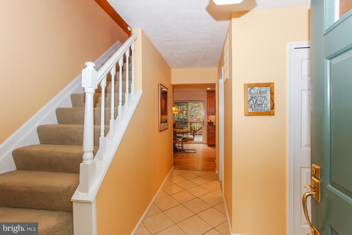 1861 Post Oak Trail Reston, VA 20191 - Photo 2 of 30 a view of a hallway with furniture and entryway