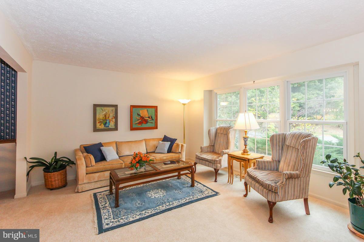 1861 Post Oak Trail Reston, VA 20191 - Photo 13 of 30 a living room with furniture and a large window