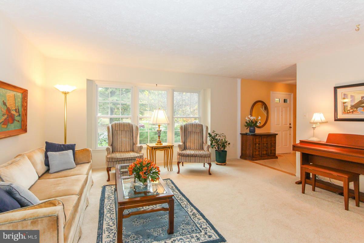 1861 Post Oak Trail Reston, VA 20191 - Photo 14 of 30 a living room with furniture and a large window