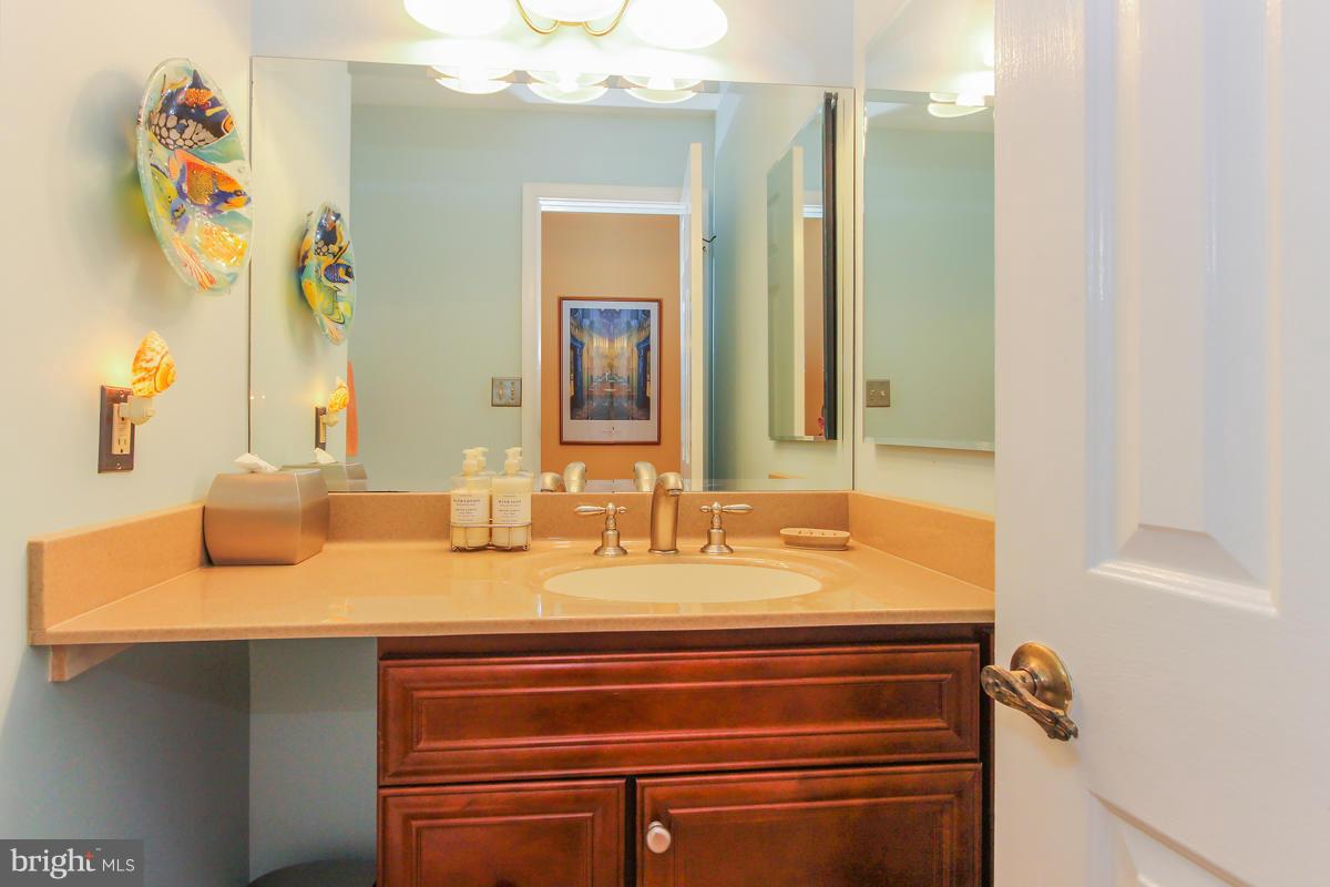 1861 Post Oak Trail Reston, VA 20191 - Photo 16 of 30 a bathroom with a sink and a mirror