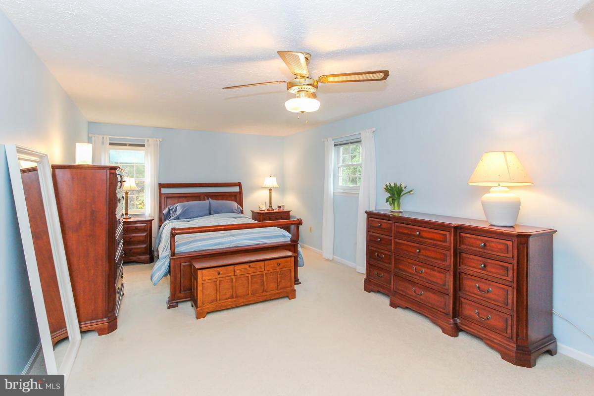 1861 Post Oak Trail Reston, VA 20191 - Photo 17 of 30 a bedroom with furniture and a window