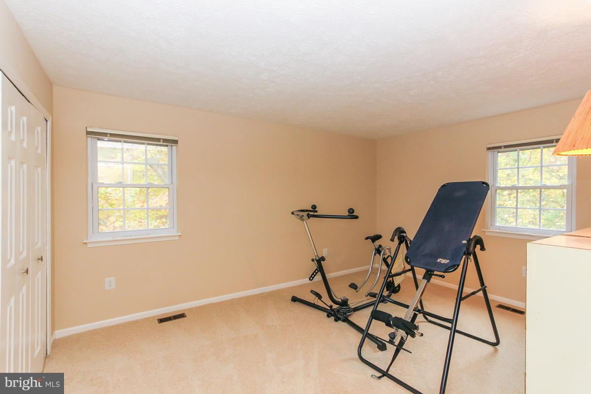 1861 Post Oak Trail Reston, VA 20191 - Photo 23 of 30 a view of a workspace with furniture and a window