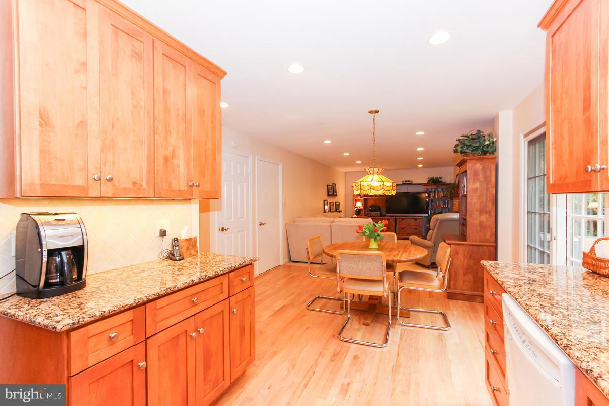 1861 Post Oak Trail Reston, VA 20191 - Photo 5 of 30 a large kitchen with a large window appliances and cabinets