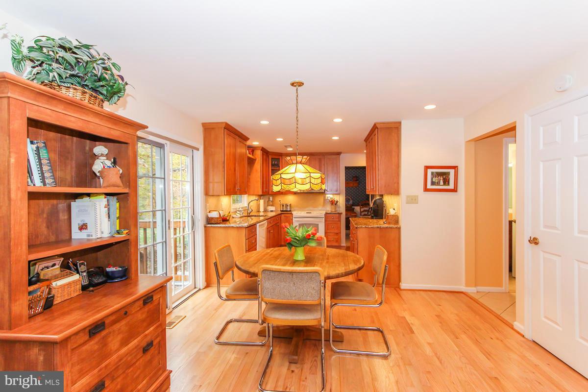 1861 Post Oak Trail Reston, VA 20191 - Photo 6 of 30 a dining room with furniture and a chandelier