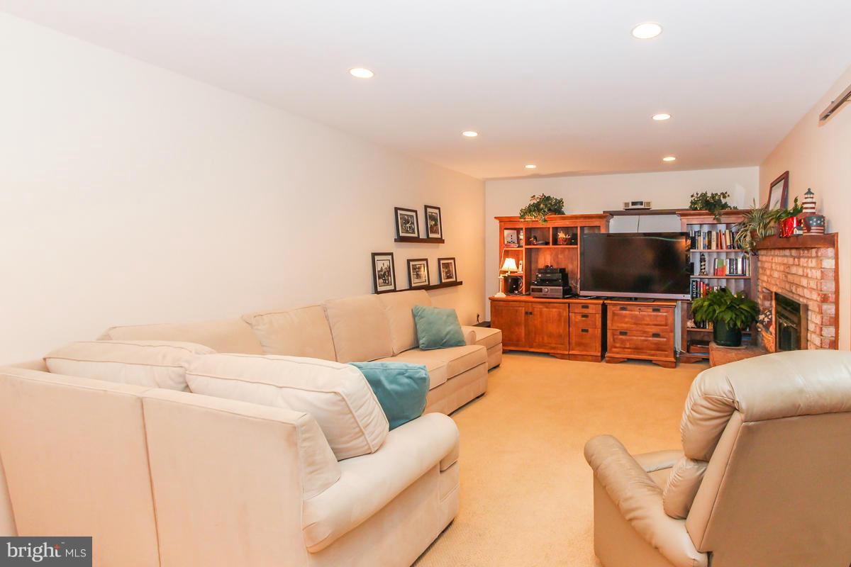 1861 Post Oak Trail Reston, VA 20191 - Photo 8 of 30 a living room with furniture and a flat screen tv