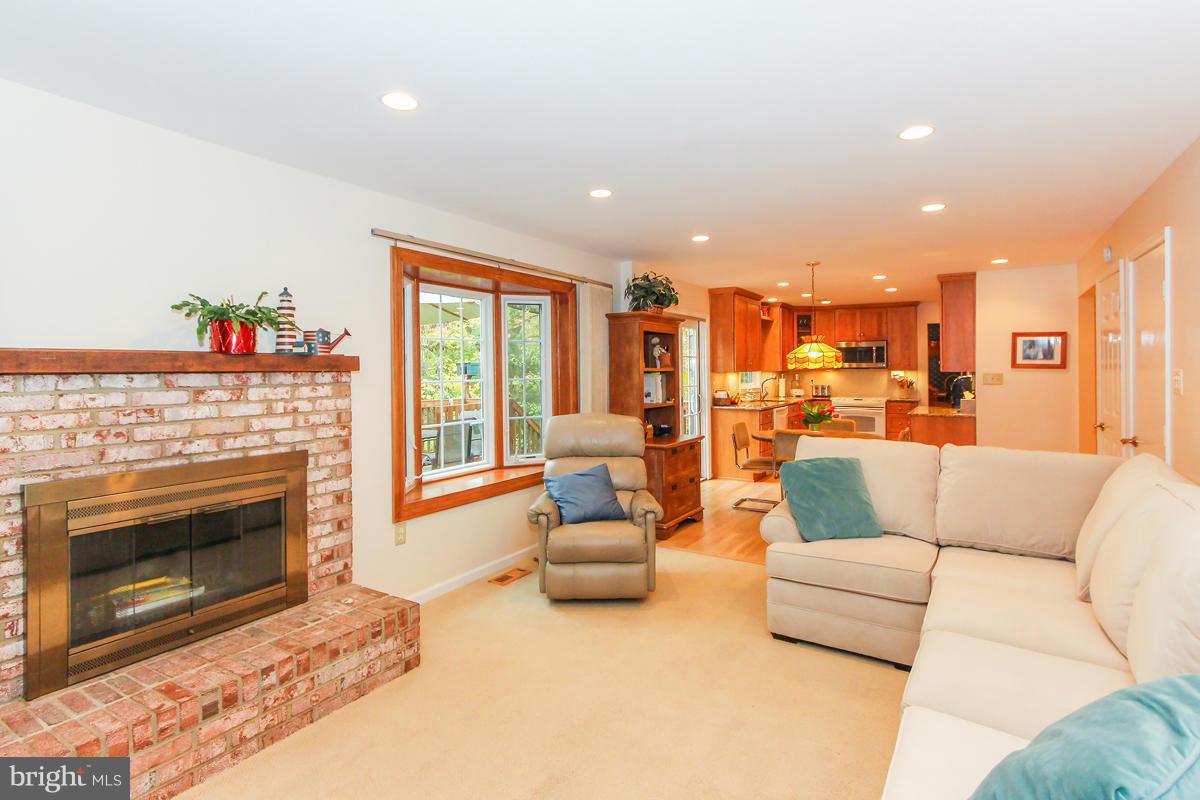 1861 Post Oak Trail Reston, VA 20191 - Photo 9 of 30 a living room with furniture and a fireplace