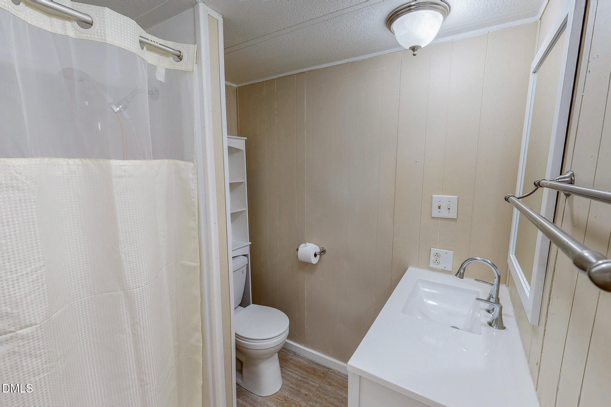410 Berea Road Rougemont, NC 27572 - Photo 12 of 18 a white toilet sitting next to a bathroom sink