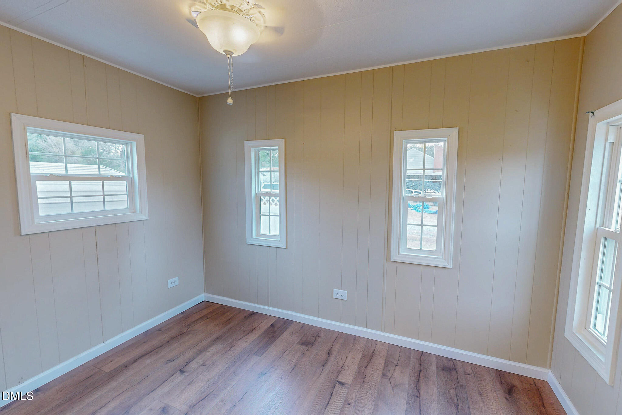 410 Berea Road Rougemont, NC 27572 - Photo 16 of 18 a view of an empty room with wooden floor and a window