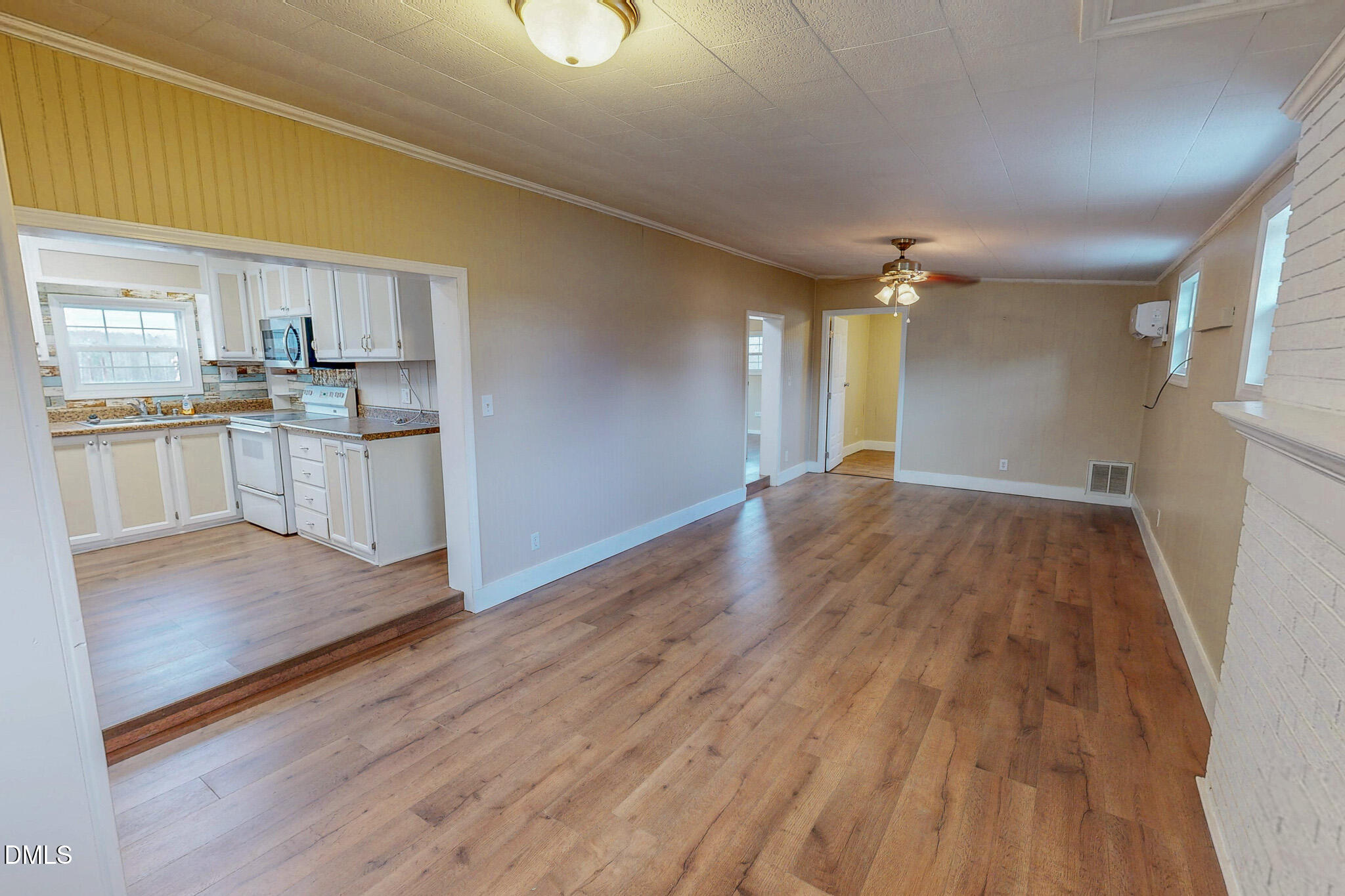 410 Berea Road Rougemont, NC 27572 - Photo 2 of 18 a open kitchen with cabinets wooden floor and stainless steel appliances