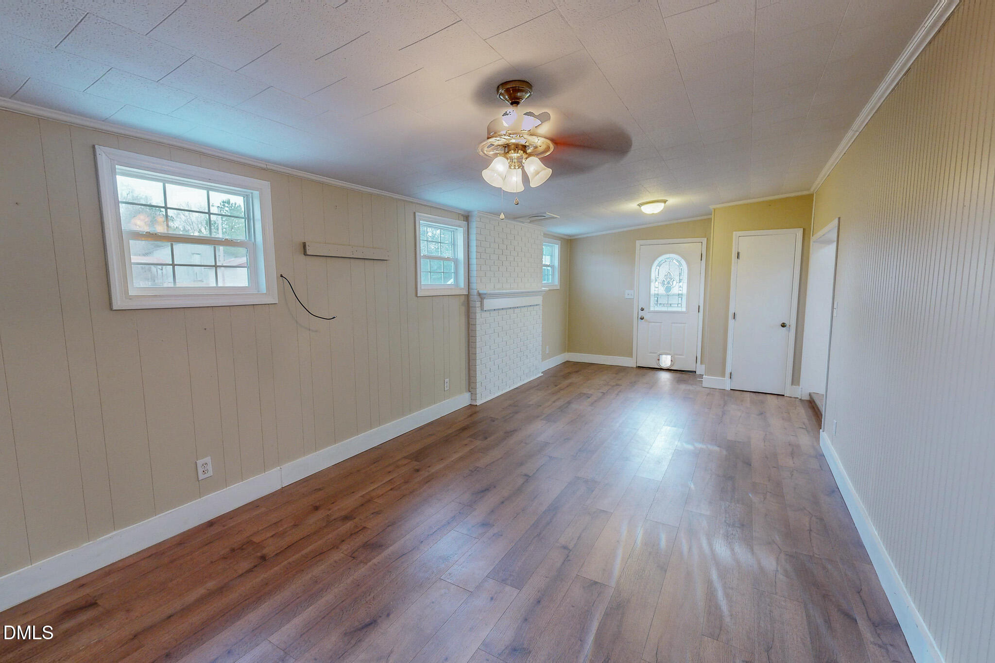 410 Berea Road Rougemont, NC 27572 - Photo 9 of 18 a view of an empty room with wooden floor and a window