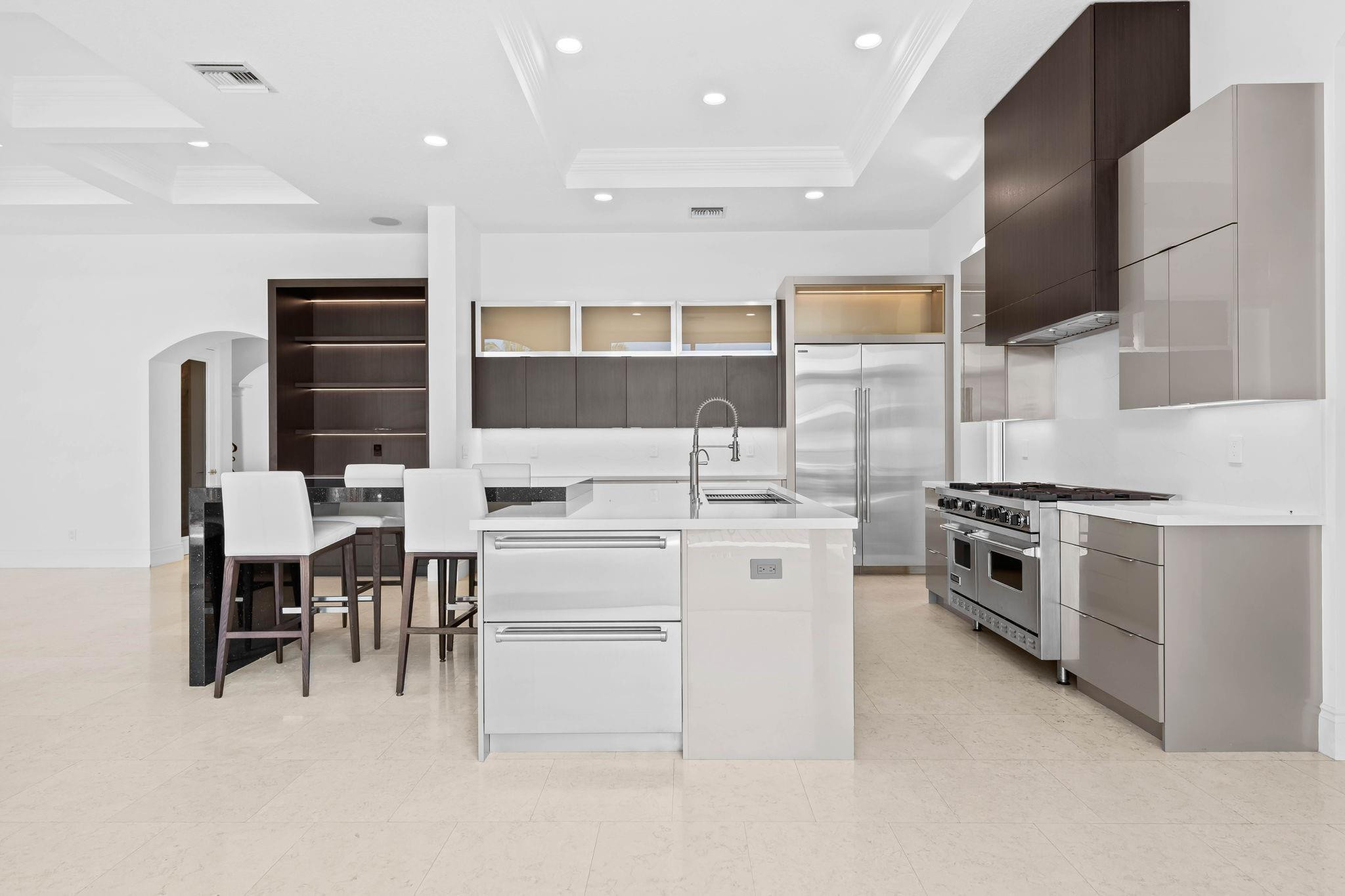 861 Nafa Drive Boca Raton, FL 33487 - Photo 28 of 58 a kitchen with cabinets and chairs