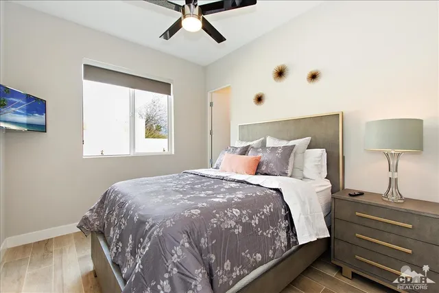 a bedroom with a bed and a window