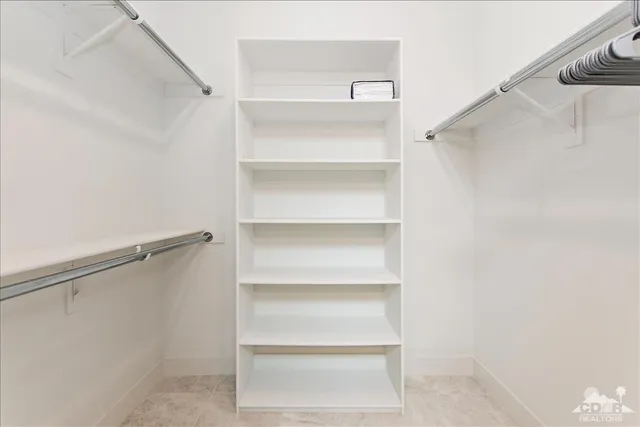 a view of an empty walk in closet