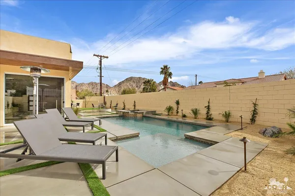 a view of a patio with chairs