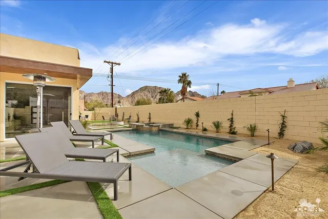 a view of a patio with chairs