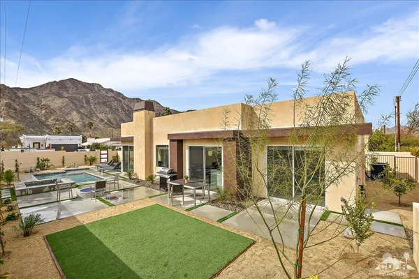 a view of a house with backyard porch and patio