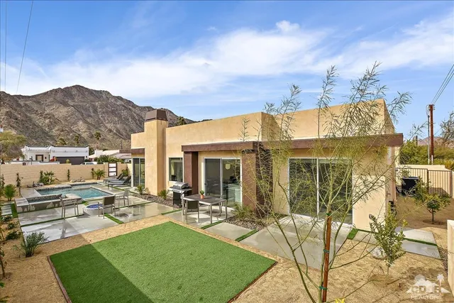 a view of a house with backyard porch and patio