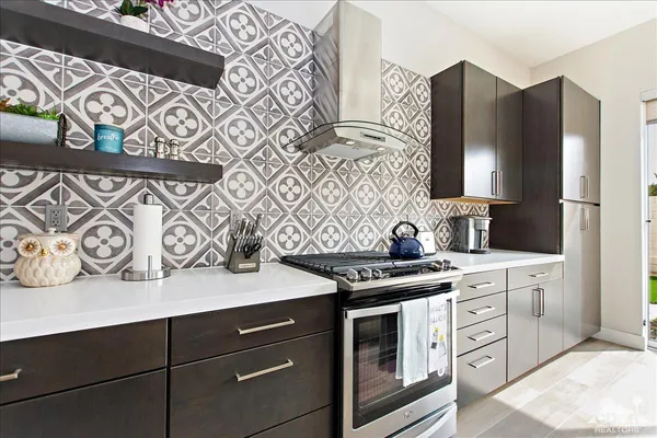 a kitchen with stainless steel appliances a stove and a refrigerator