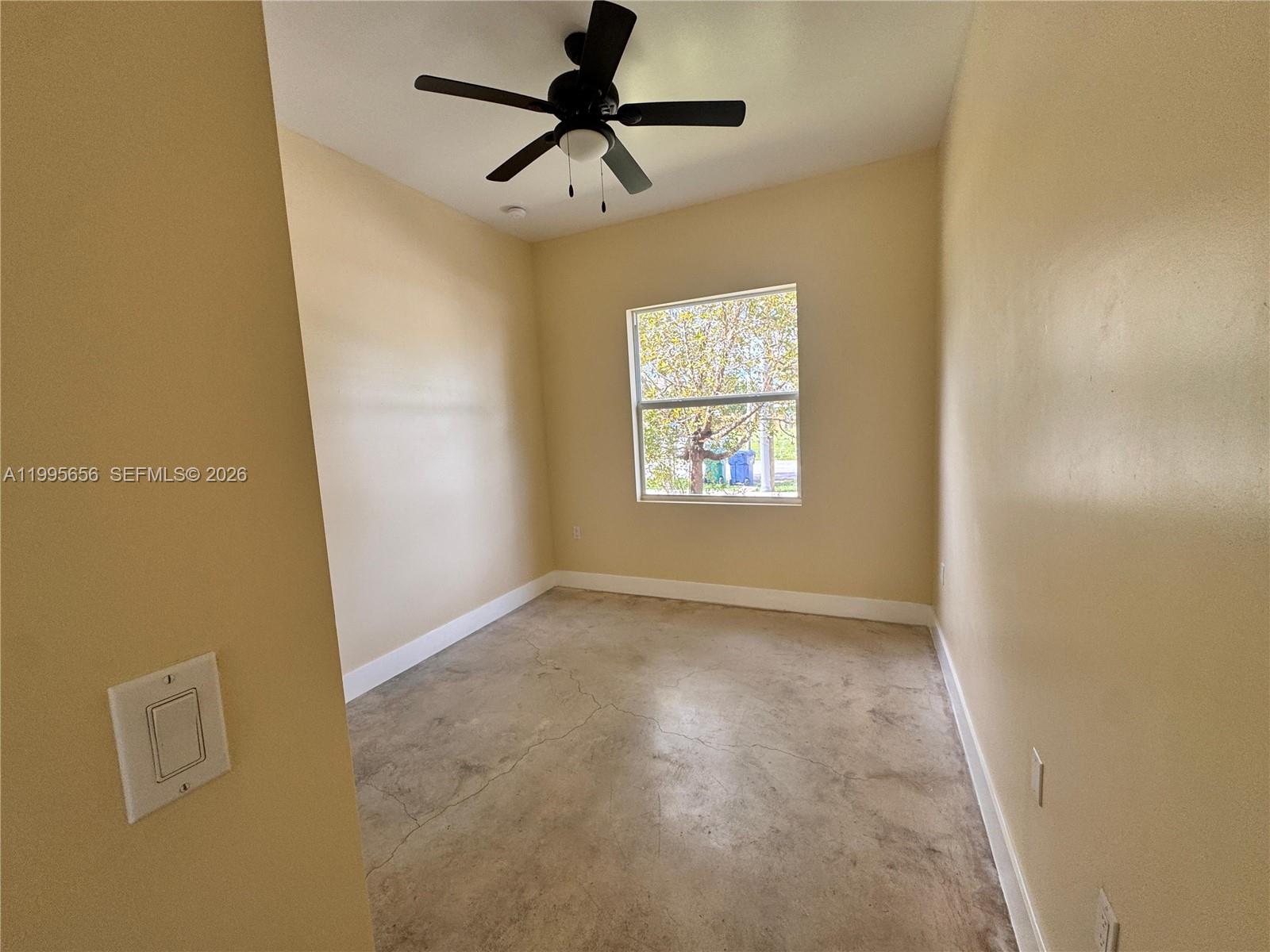 12150 Southwest 213th Street, Unit 12150 Miami, FL 33177 - Photo 14 of 16 a view of an empty room and a window