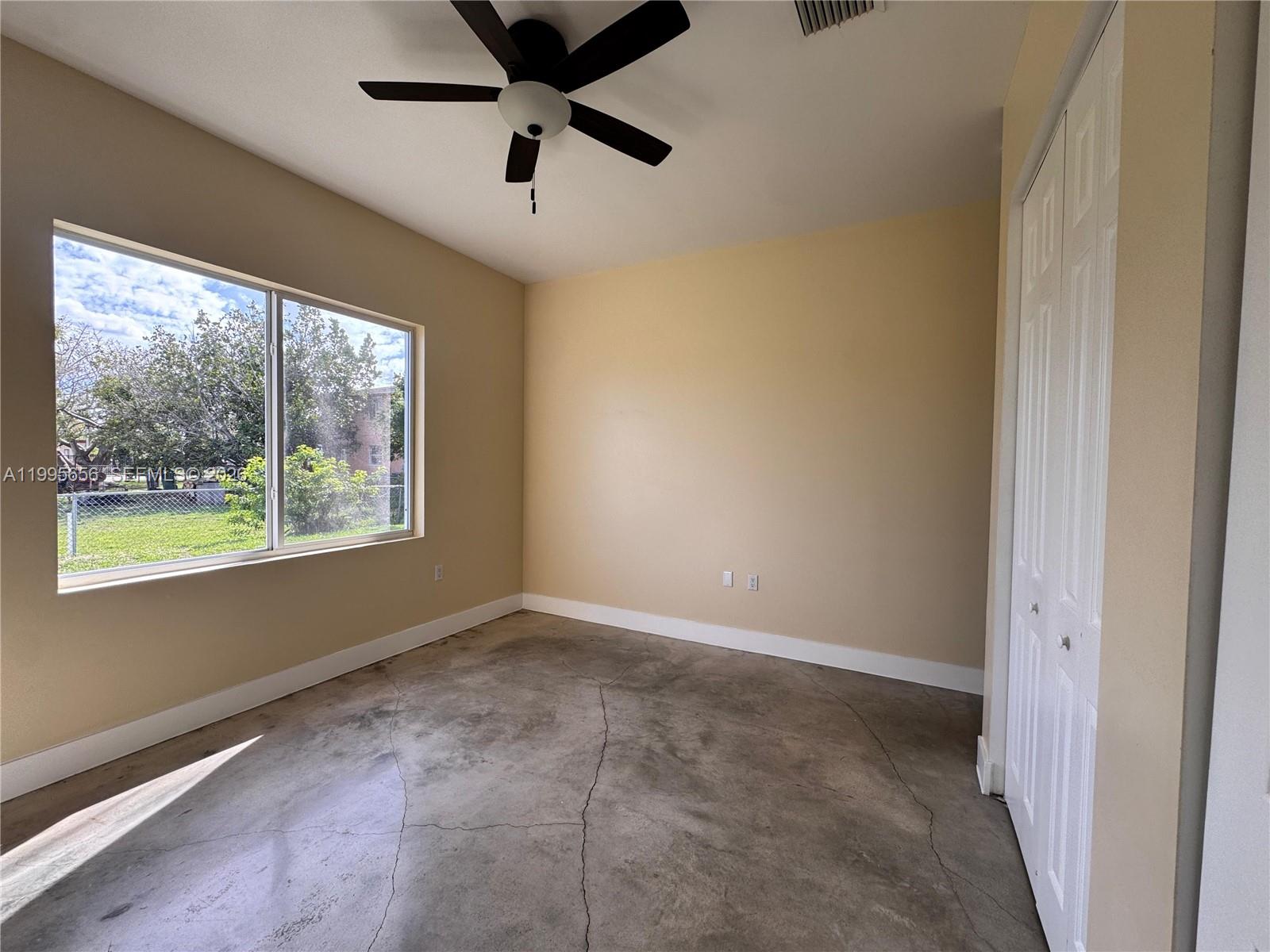 12150 Southwest 213th Street, Unit 12150 Miami, FL 33177 - Photo 6 of 16 a view of an empty room and window