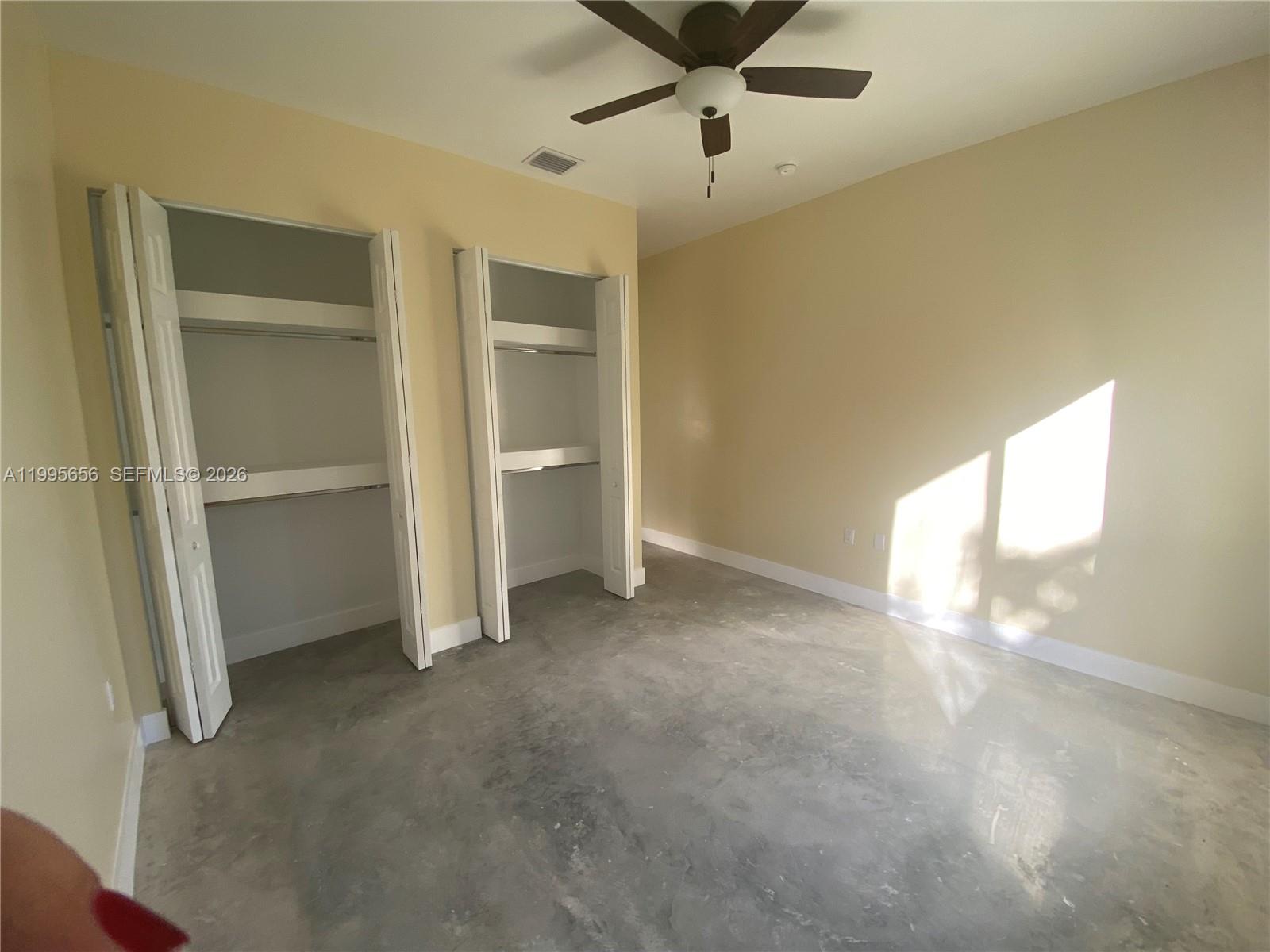 12150 Southwest 213th Street, Unit 12150 Miami, FL 33177 - Photo 7 of 16 a view of an empty room and a window