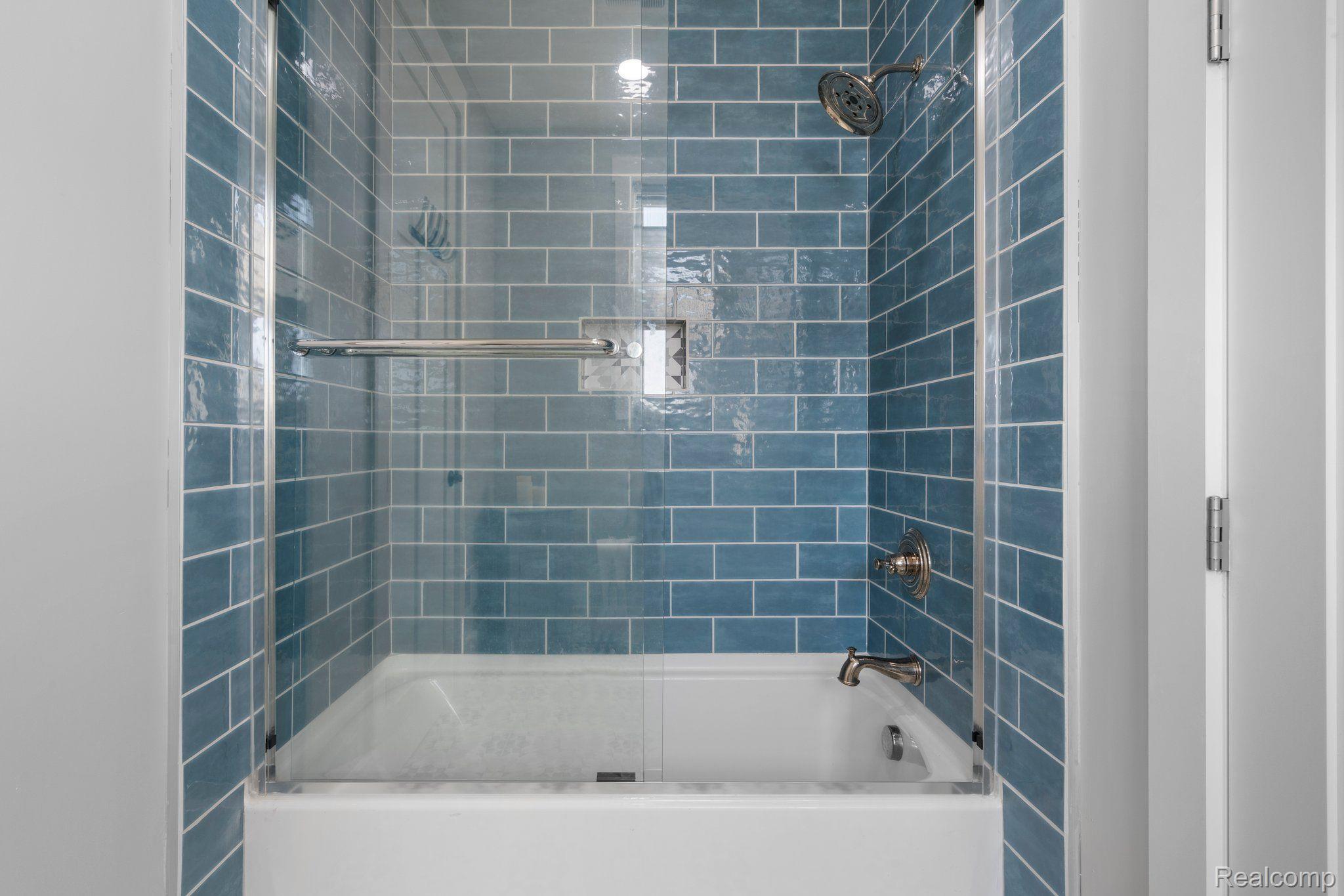 5057 Pardee Road East Webberville, MI 48892 - Photo 27 of 78 They Share a shower with an amazing blue tile