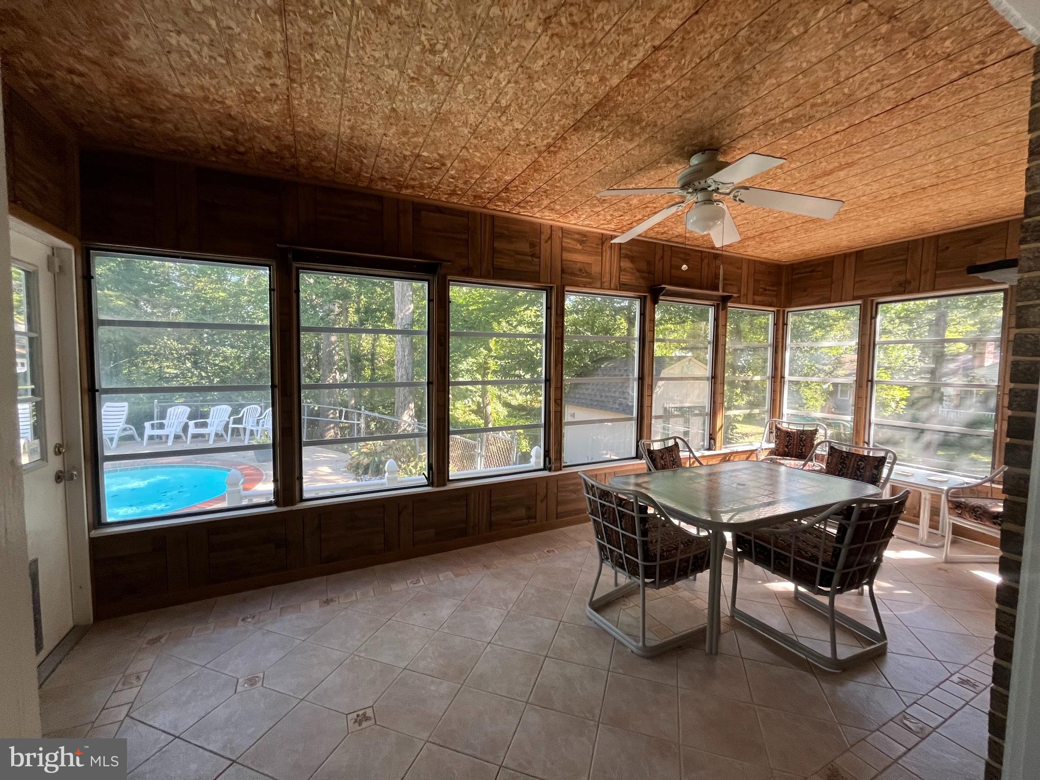 3203 Riverview Drive Triangle, VA 22172 - Photo 16 of 78 a dining room with furniture and a floor to ceiling window