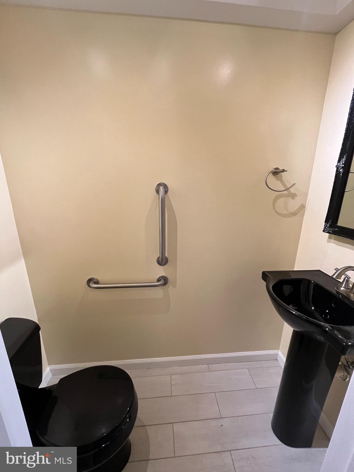 3203 Riverview Drive Triangle, VA 22172 - Photo 21 of 78 a bathroom with a toilet and a mirror