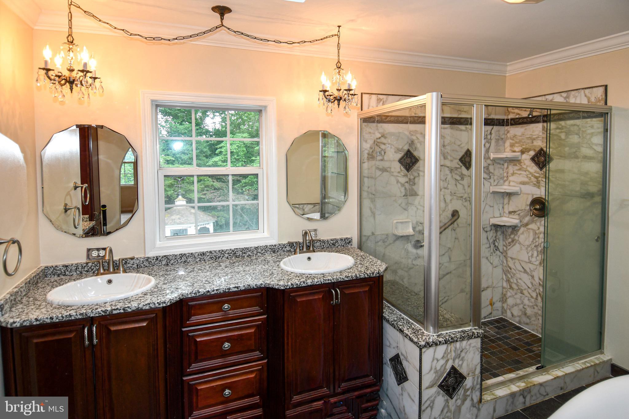 3203 Riverview Drive Triangle, VA 22172 - Photo 28 of 78 a bathroom with a granite countertop sink a mirror and shower