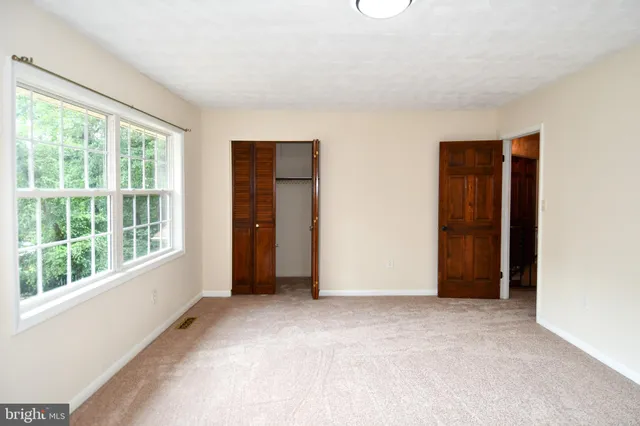 a view of a room with racks on the wall