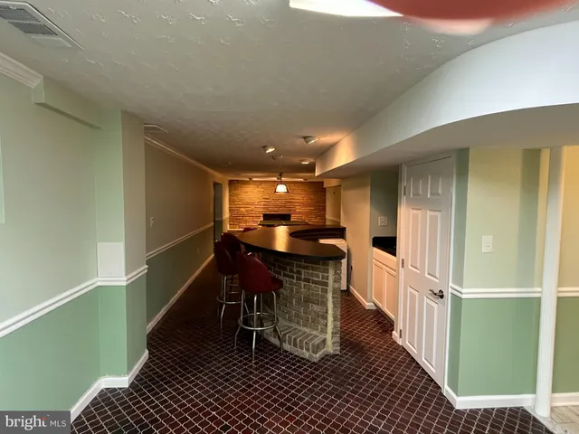 a view of a house with swimming pool and porch with furniture