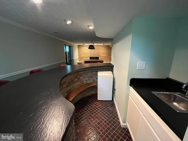a view of a chair and table in the deck