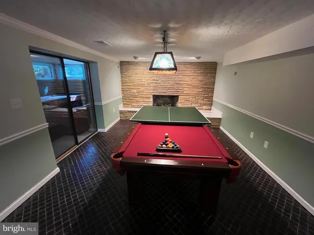 a view of a yard with plants and a bench
