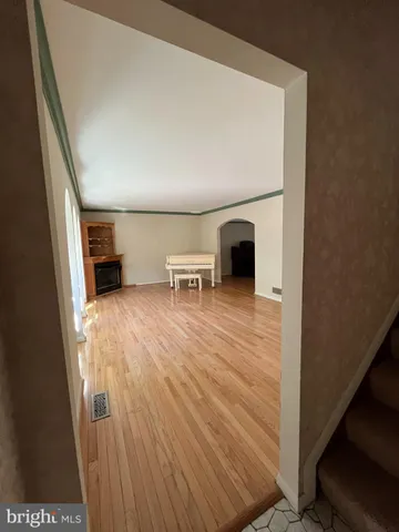 a view of a livingroom with furniture and a fireplace