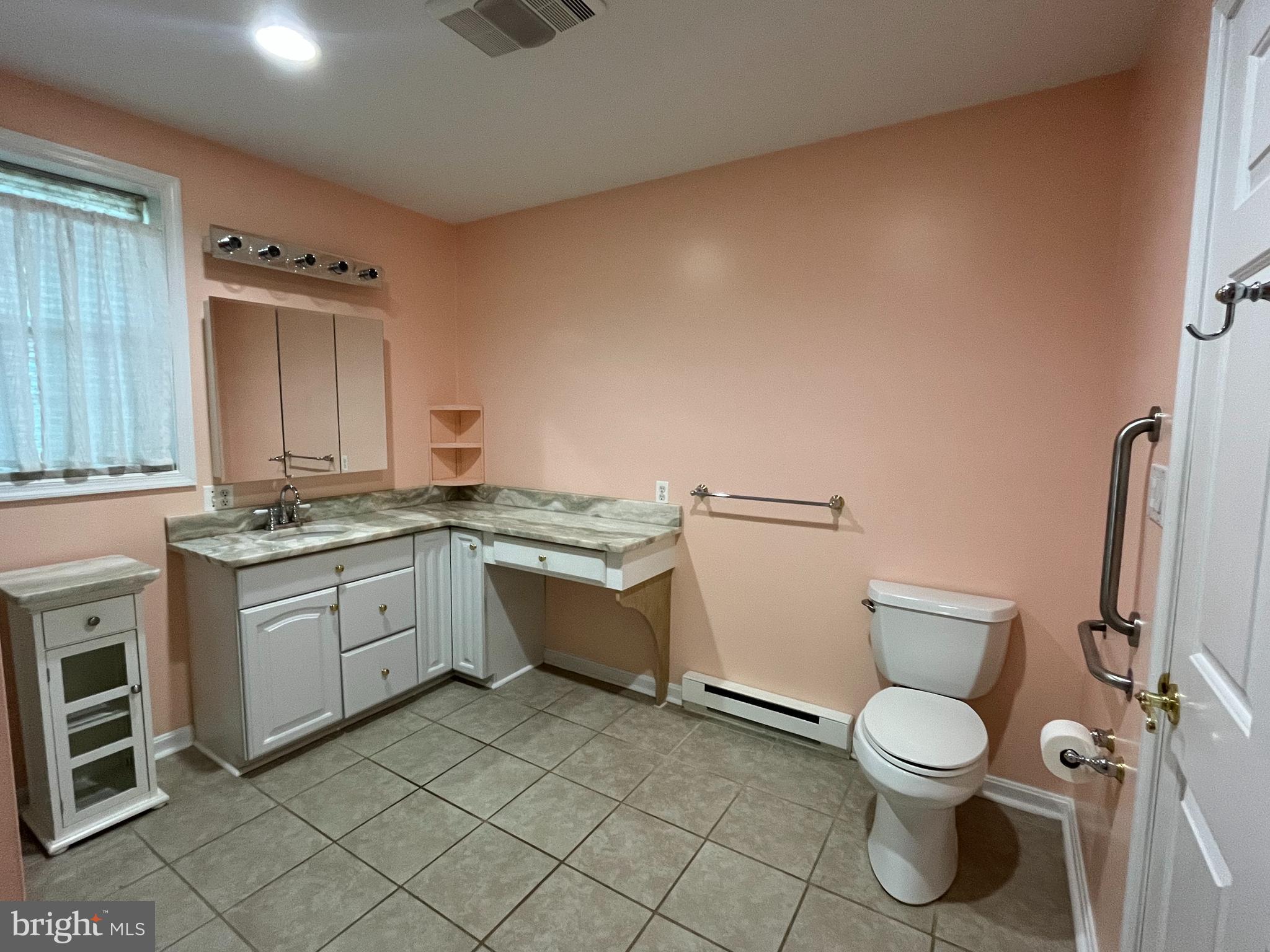 3203 Riverview Drive Triangle, VA 22172 - Photo 62 of 78 a bathroom with a granite countertop toilet sink and mirror