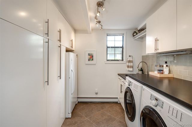 a view of a kitchen with washer and dryer
