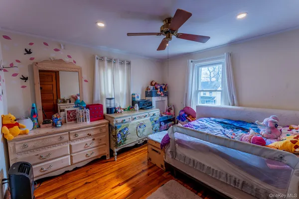 a kids room with furniture and window