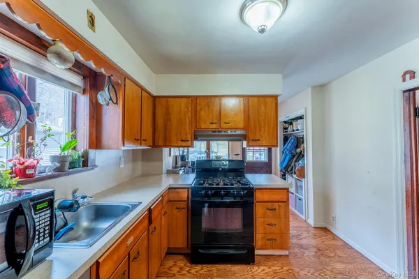a kitchen with stainless steel appliances granite countertop a stove and a sink